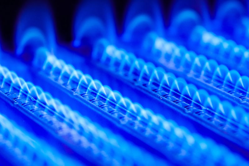Up close of blue, hot, furnace coils.